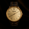 Omax Quartz Watch gold rim metal strap